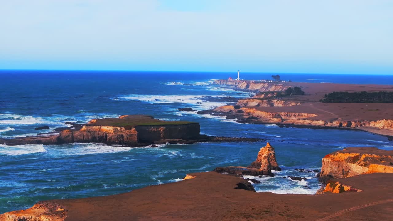 Point Arena Lighthouse Sea Lion Rocks Cove Racas California aerial drone Stornetta coastal Trail Mendocino coast sunny daytime morning afternoon blue sky waves vista point scenic view circle left