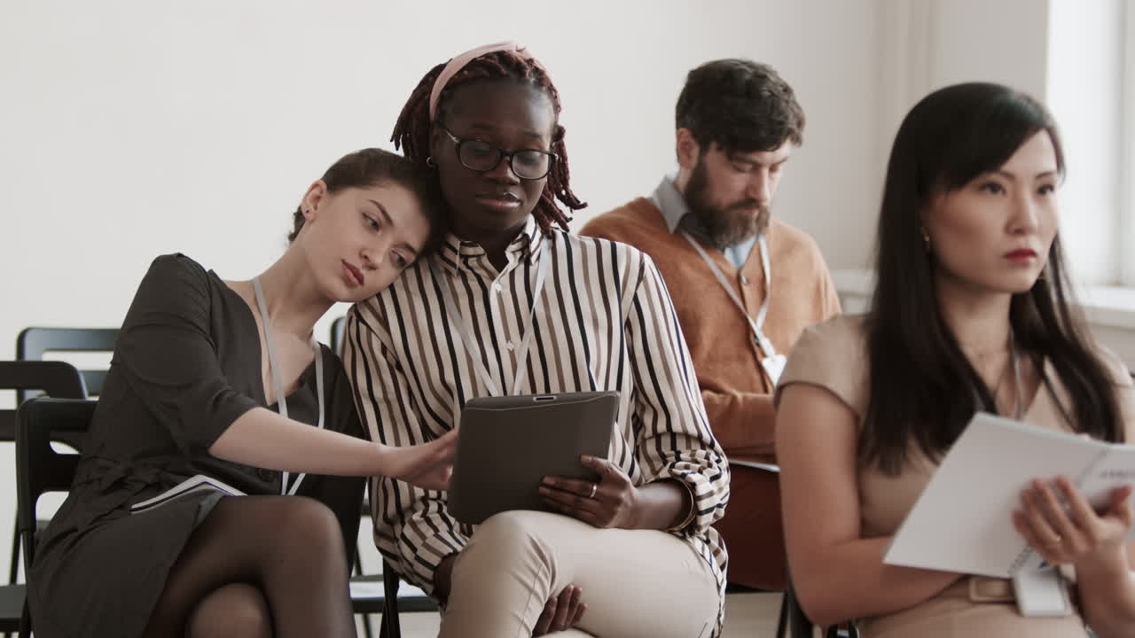 Businesswoman Leaning on Shoulder of Girlfriend