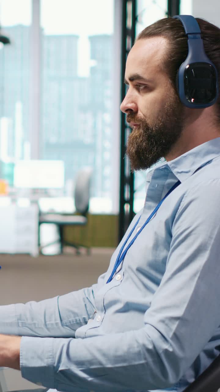 Vertical video Developer coding with AI language model assistance in office, listening music