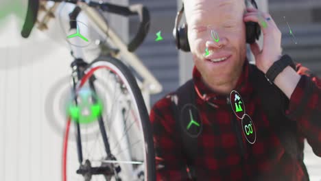 animation of icons, albino african american man listening to music wearing headphones with bicycle