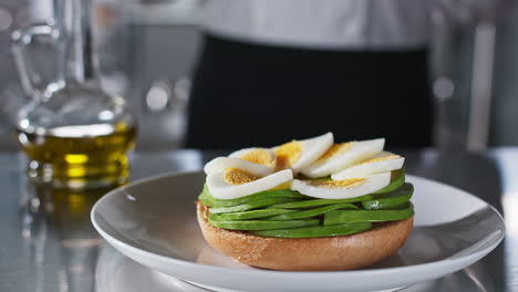 delicious avocado and egg bagel sandwich