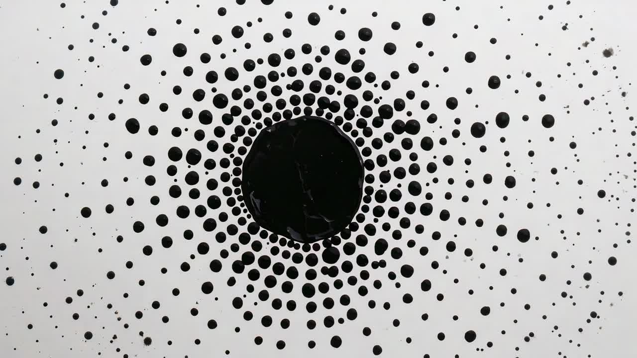 Expanding central black pool pulling droplets inward on white panel, merging forming denser rings