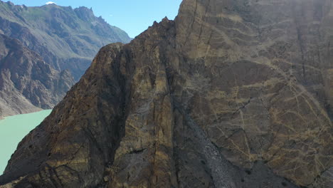slow aerial reveal of scenic attabad lake, hunza valley, pakistan