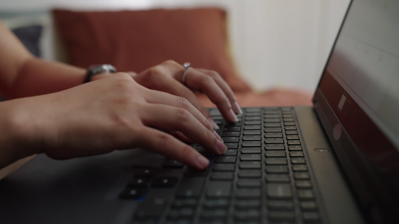 Hands of Person Typing on Laptop Indoors