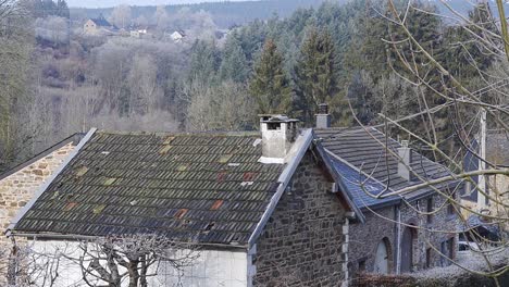 belgian architectural farm houses with the hills in the background in southern, belgium