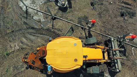 tractor on construction site. aerial view of site preparation and construction in progress