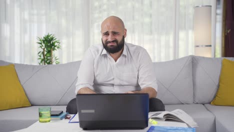 home office worker man looking at camera with disgust and hatred.