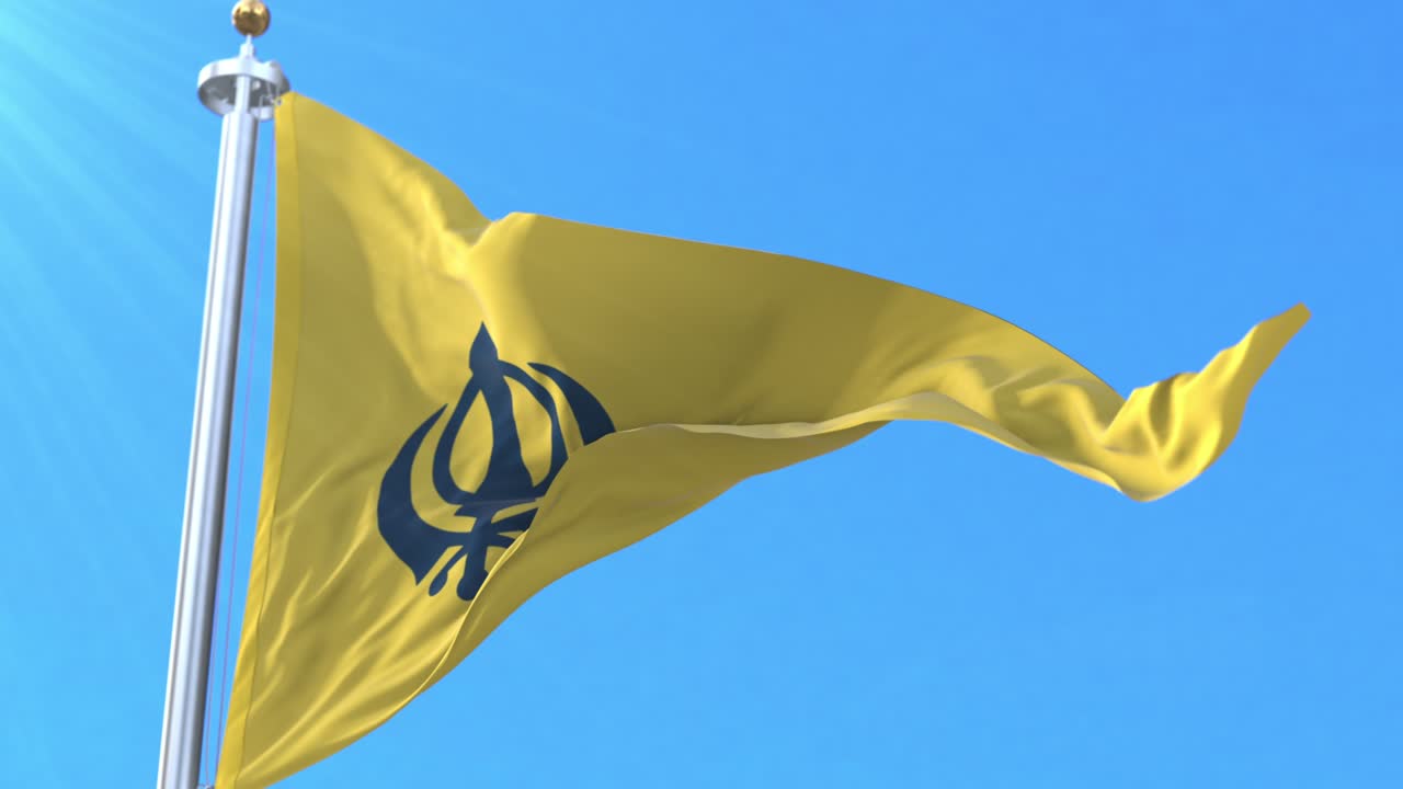 basanti nishan sahib con la bandera de khanda. el bucle