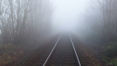 mist over the train tracks in misterton, somerset