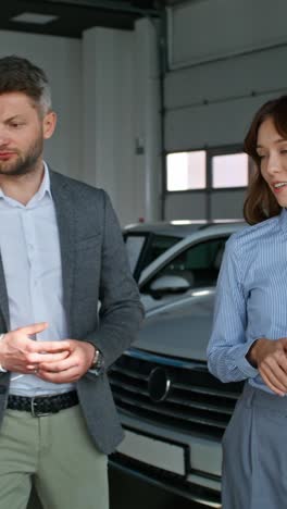 business deal in a car showroom