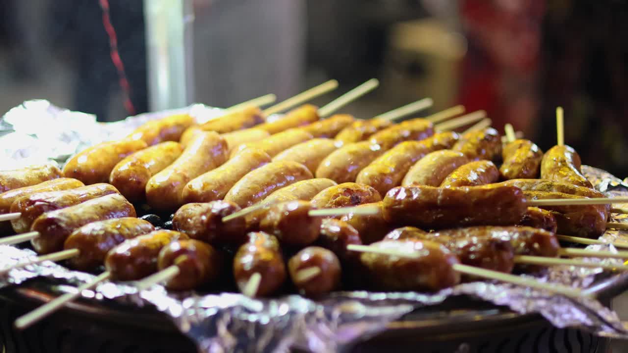 Grilled sausages on skewers at a street stall