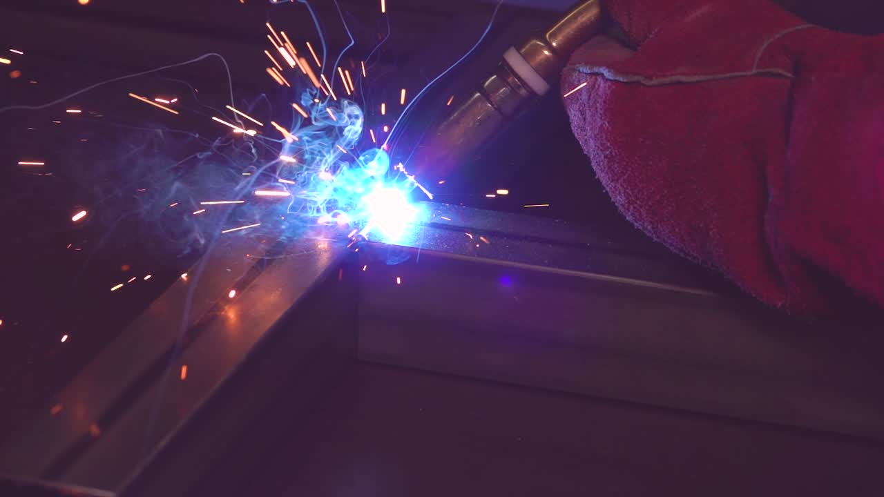 Worker on manufacture welding metal construction