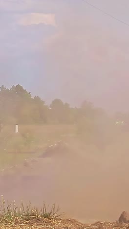 an explosion blows a large hole in the ground. close up shot.