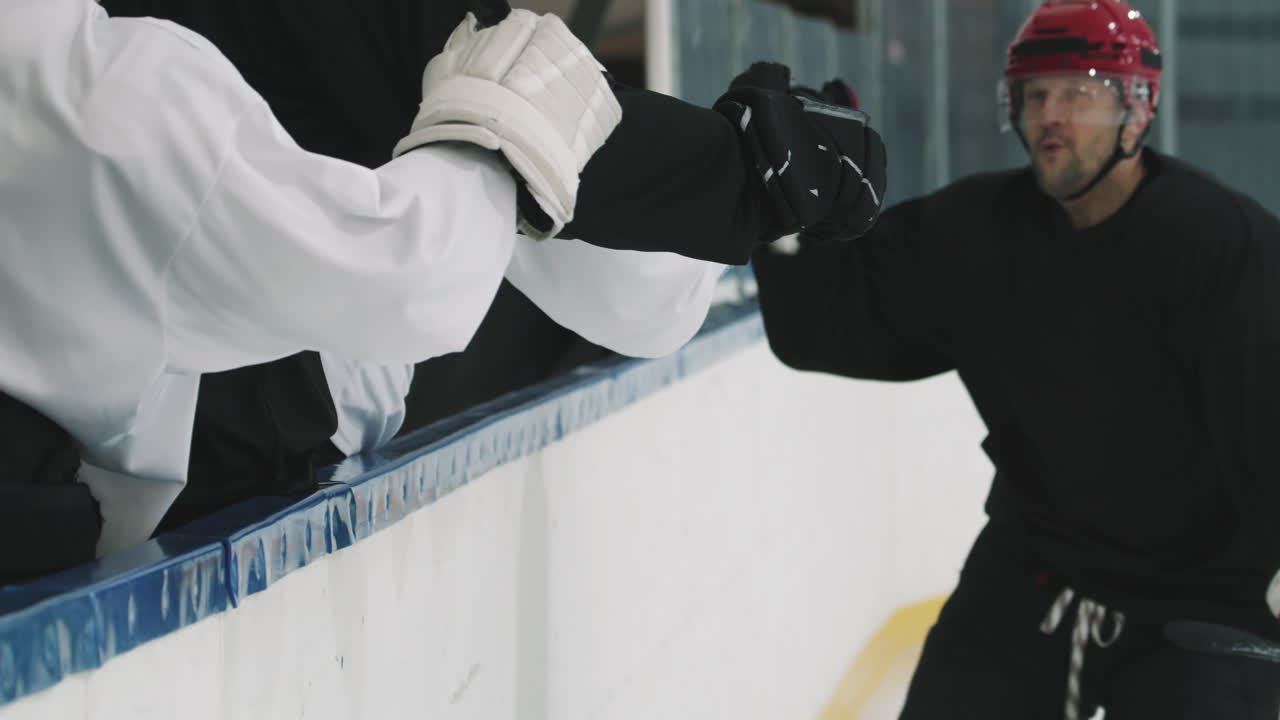 Hockey Player Giving High Fives To Team Members
