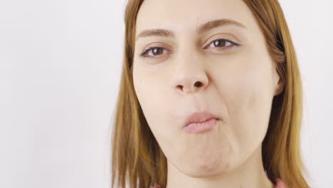 woman eating chocolate in close-up. eating chocolate.