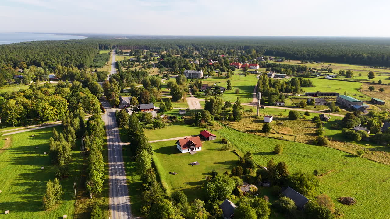 Aerial Rotation Over The Scenic Coastal Road (P111) In Jurkalne, Latvia. Travel, Vacation, And Tourism Along The Baltic Sea Coast Of Northern Europe.