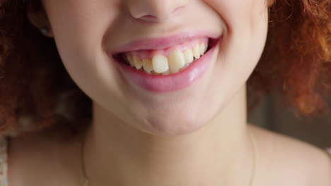 closeup of laughing people showing teeth