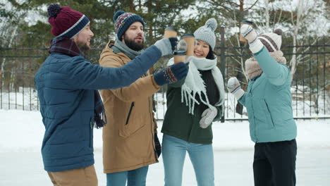 friends enjoying coffee outdoors in winter