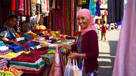 vibrant market scene with clothing and produce