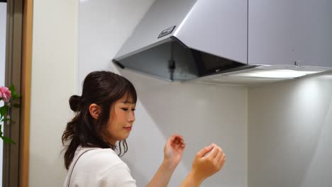 woman installing a ventilator filter