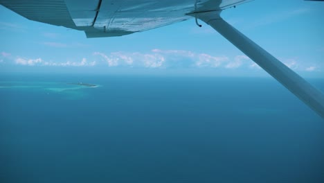 small tropical island in the middle of ocean on clear sunny day in africa