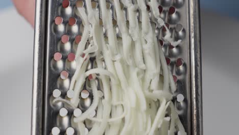 freshly grated cheese sprinkled on cooking