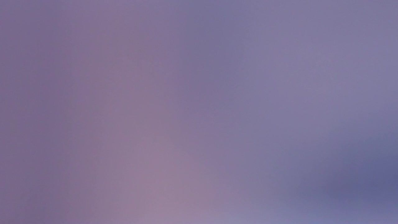 avalanche of blue pills falling right in front of the camera with 1960's style coloration