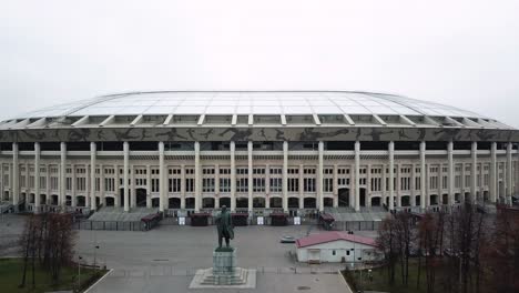 drone moving back from the statue of lenin in front of the luzhniki stadium showing its immensity, in moscow, russia