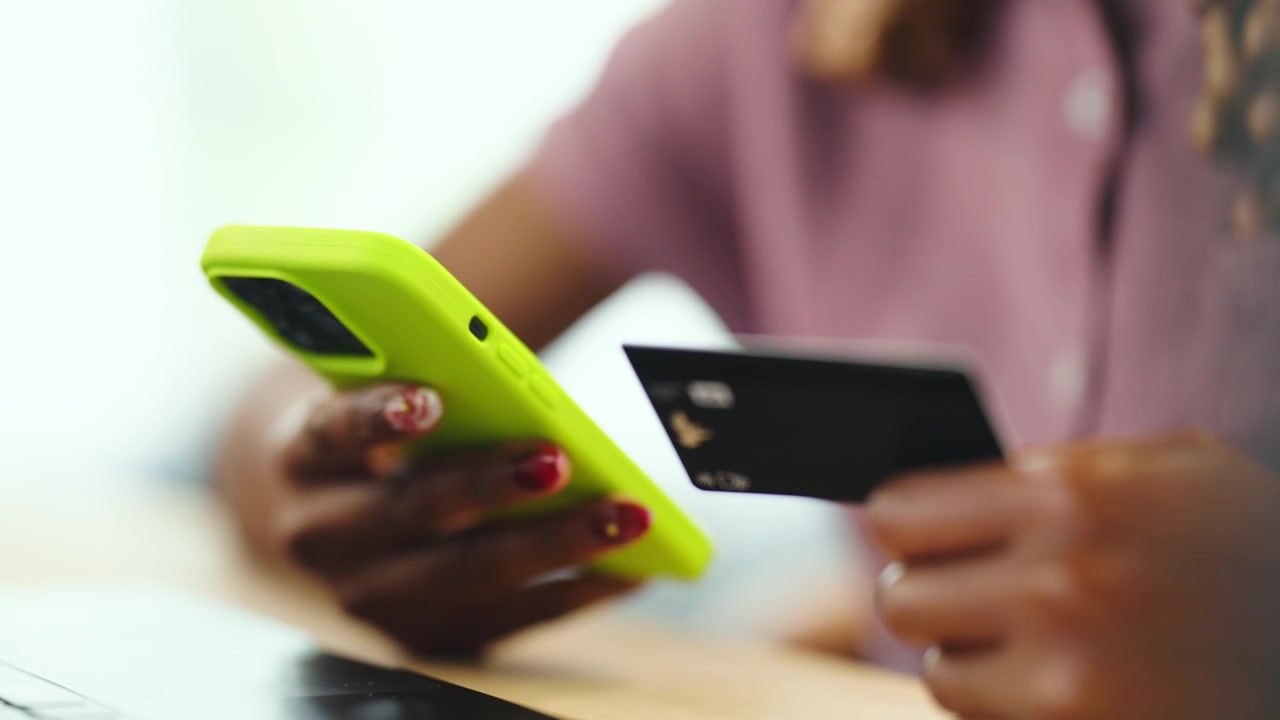 Woman Making Online Purchase with Credit Card and Smartphone