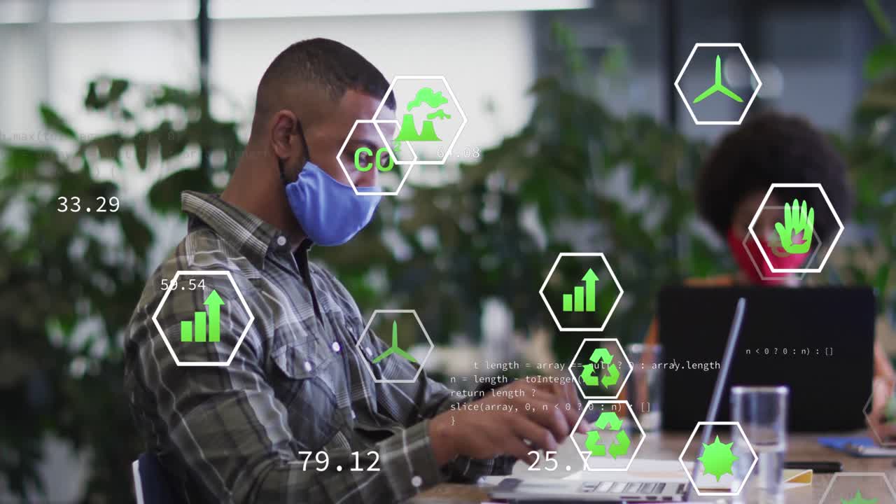 animación de iconos de ecología sobre un empresario afroamericano que usa una máscara facial y usa una computadora