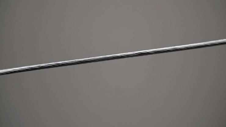 Close-up of a Steel Wire Rope Against a Neutral Background