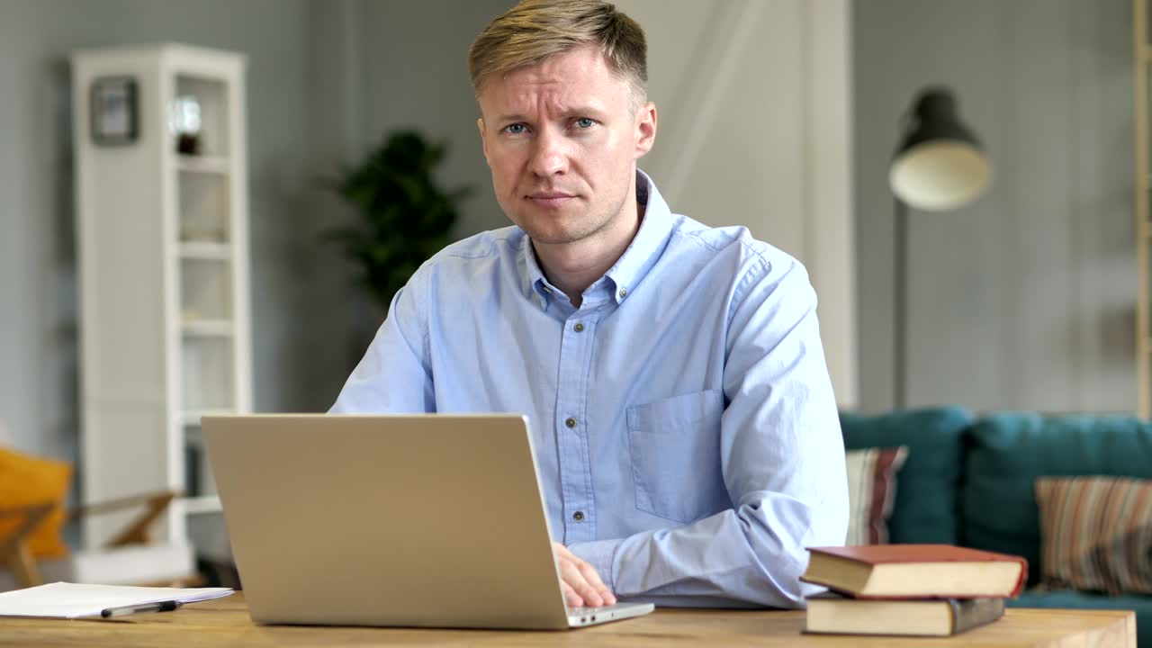 Businessman Rejecting Offer by Waving Finger at Work