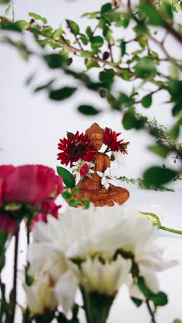 buddha statue with flowers