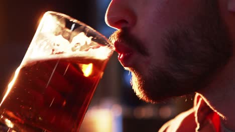 close-up of man drinking beer