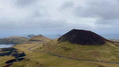 helgafell volcano on heimaey island in iceland under cloudy sky, aerial view