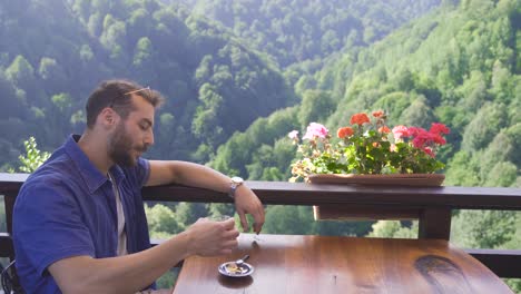 Tourist-Enjoying-Fresh-Air-While-Relaxing-After-Hiking-In-The-Forest-On-Sunny-Summer-Day.