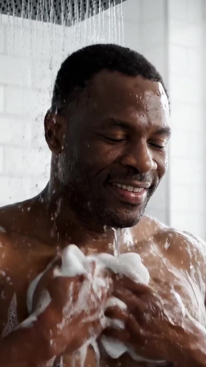 A Man's Refreshing Shower Experience: Embracing Relaxation and Cleanliness with Water and Soap for a Moment of Serenity in Daily Life