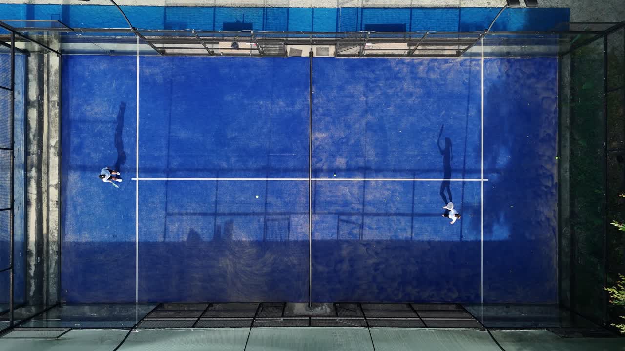 Aerial view of a padel court with players