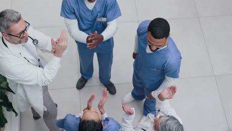 Top-view,-teamwork-or-hands-of-doctors