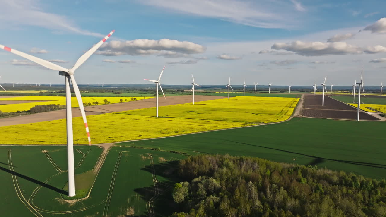 Wind Turbines Generating Electricity In Scenic Farm - Drone Shot