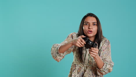 Upset-woman-showing-thumbs-down-sign-gesturing-holding-controller