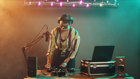 young musician acting cool looking at mixer