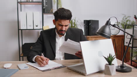 stressed businessman work at unpaid bank debt, doing paperwork, planning budget, throws paper bills