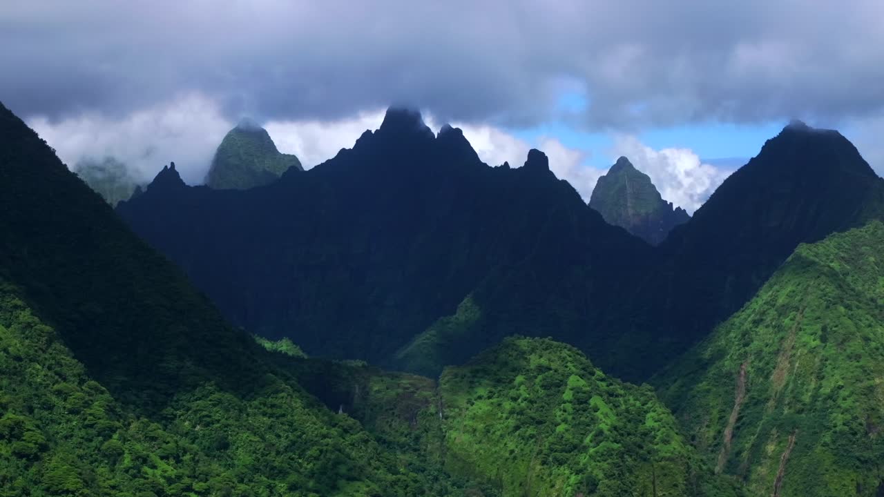 Vallee de Tautira River Valley Bay Vaitepiha villageTeahupoo Tahiti island French Polynesia aerial drone jagged mountain Aorai peak Aorai Taiarapu Taravao North Shore cloudy shade parallax zoom out