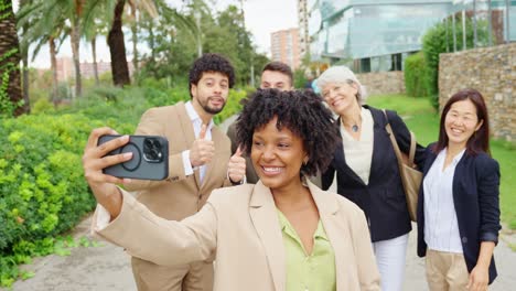 A group of business people taking a selfie together