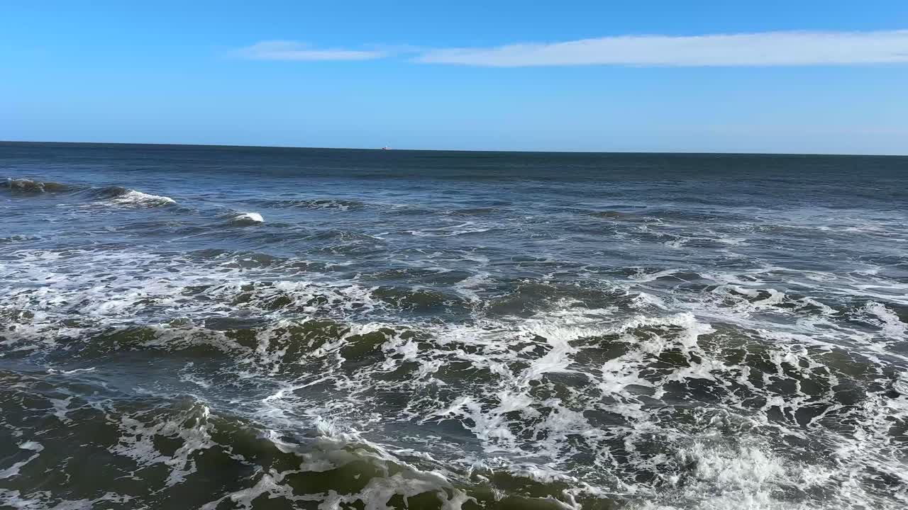 North sea waves crashing onto the shore north east england sunderland british coastline uk