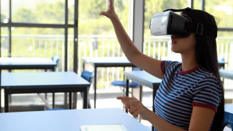 student using virtual reality headset in classroom