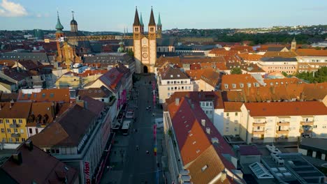 4k aerial drone video of the city hall clock tower and wurzburg cathedral in downtown würzburg, germany