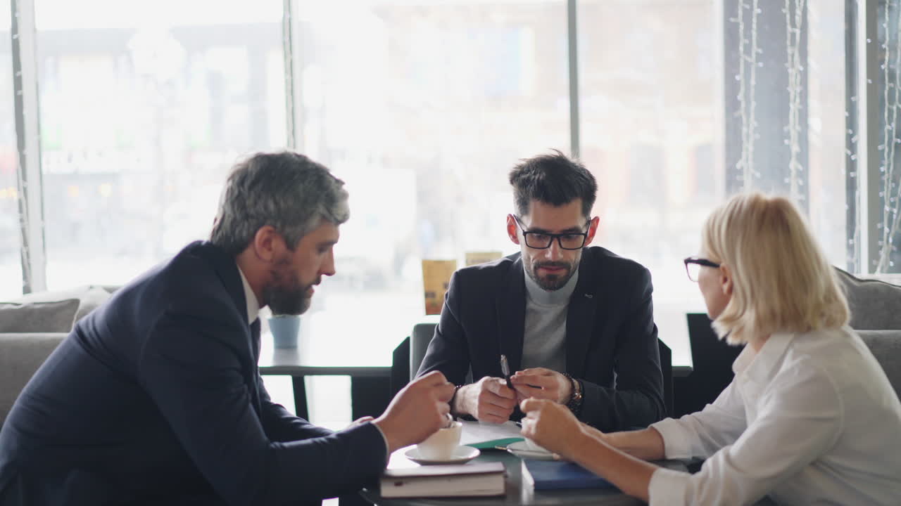 Business People Meeting in a Cafe