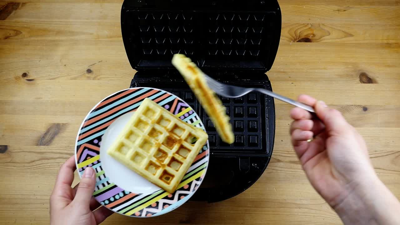 taking waffles out of a waffle iron